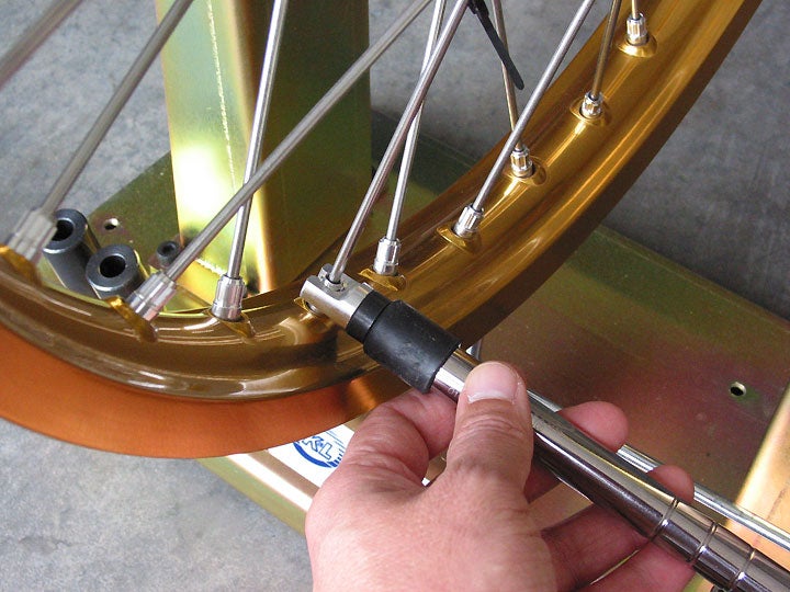 tightening spokes on dirt bike